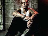 Eminem holding a knife